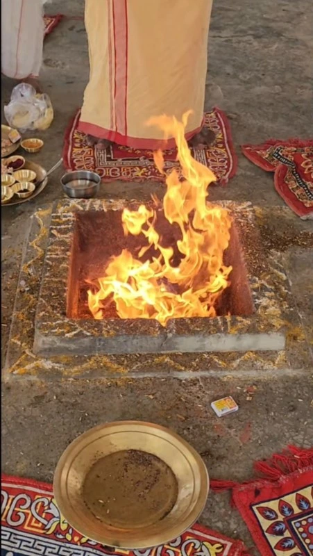 Traditional pooja arrangement with idols and flowers