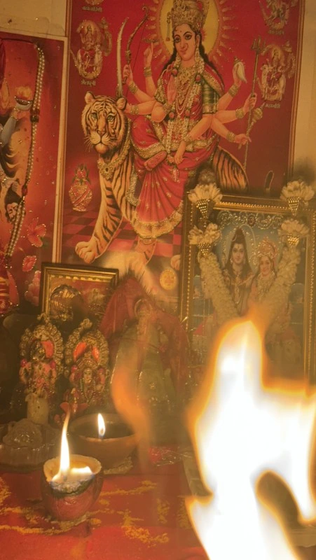 Devotional pooja setup with diya and पूजा सामग्री