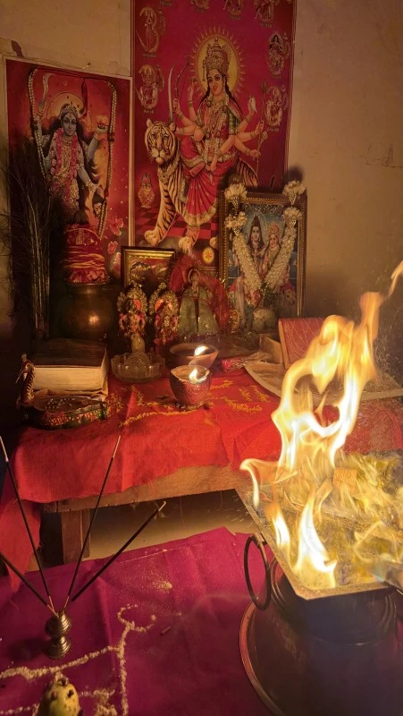 Durga maa pooja ritual with offerings and prayer setup