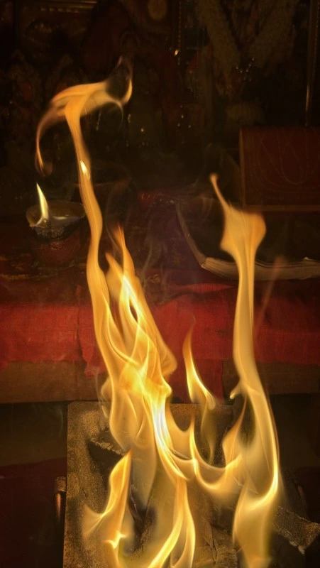 Religious ceremony with diya, flowers and sacred rituals